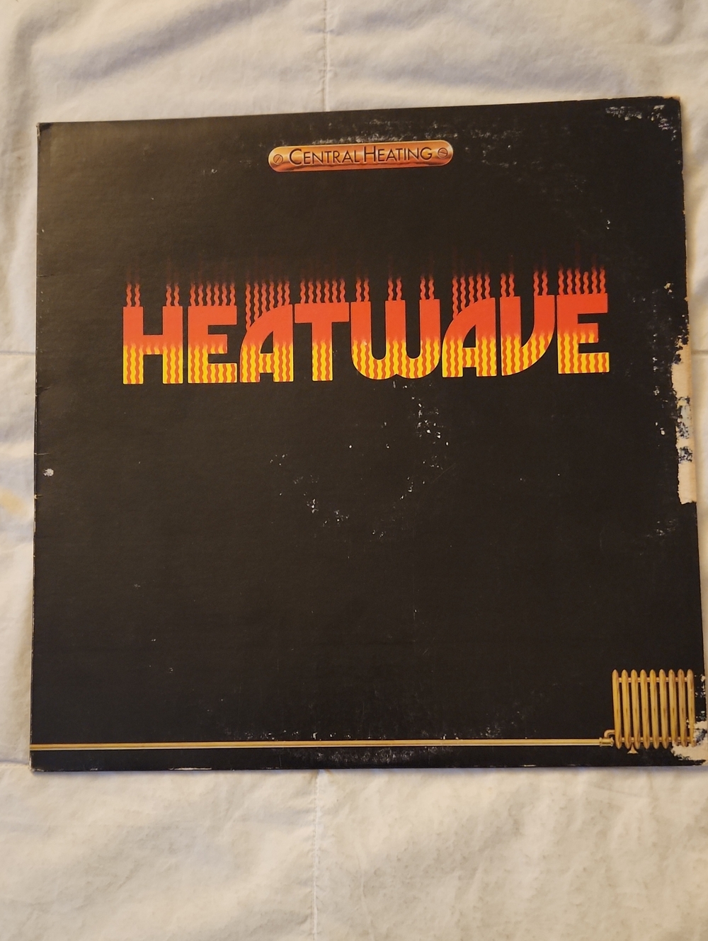 - Heatwave Vinyl Record (Black/Orange/Yellow)